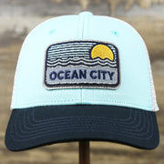 The front of the New Jersey Ocean City Sunset Mesh Back Trucker Hat | Black And Grey Mesh Trucker Hat