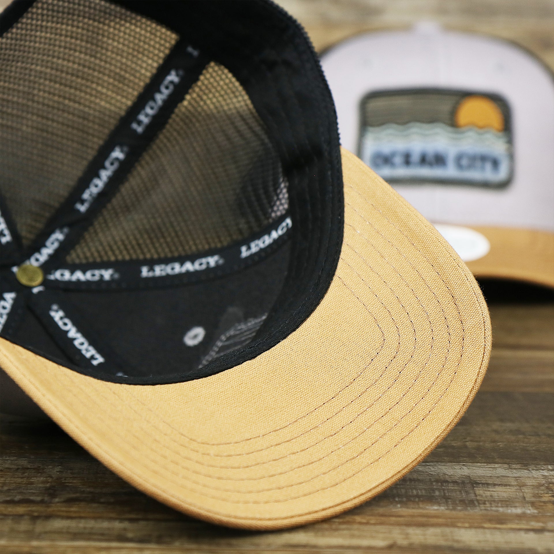 The Caramel undervisor on the Youth New Jersey Ocean City Sunset Mesh Back Trucker Hat | Gray And Black Mesh Youth Trucker Hat