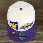 An overhead shot of the Los Angeles Lakers NBA 2022 Draft Gray Bottom 9Fifty Snapback | New Era Cream/Purple