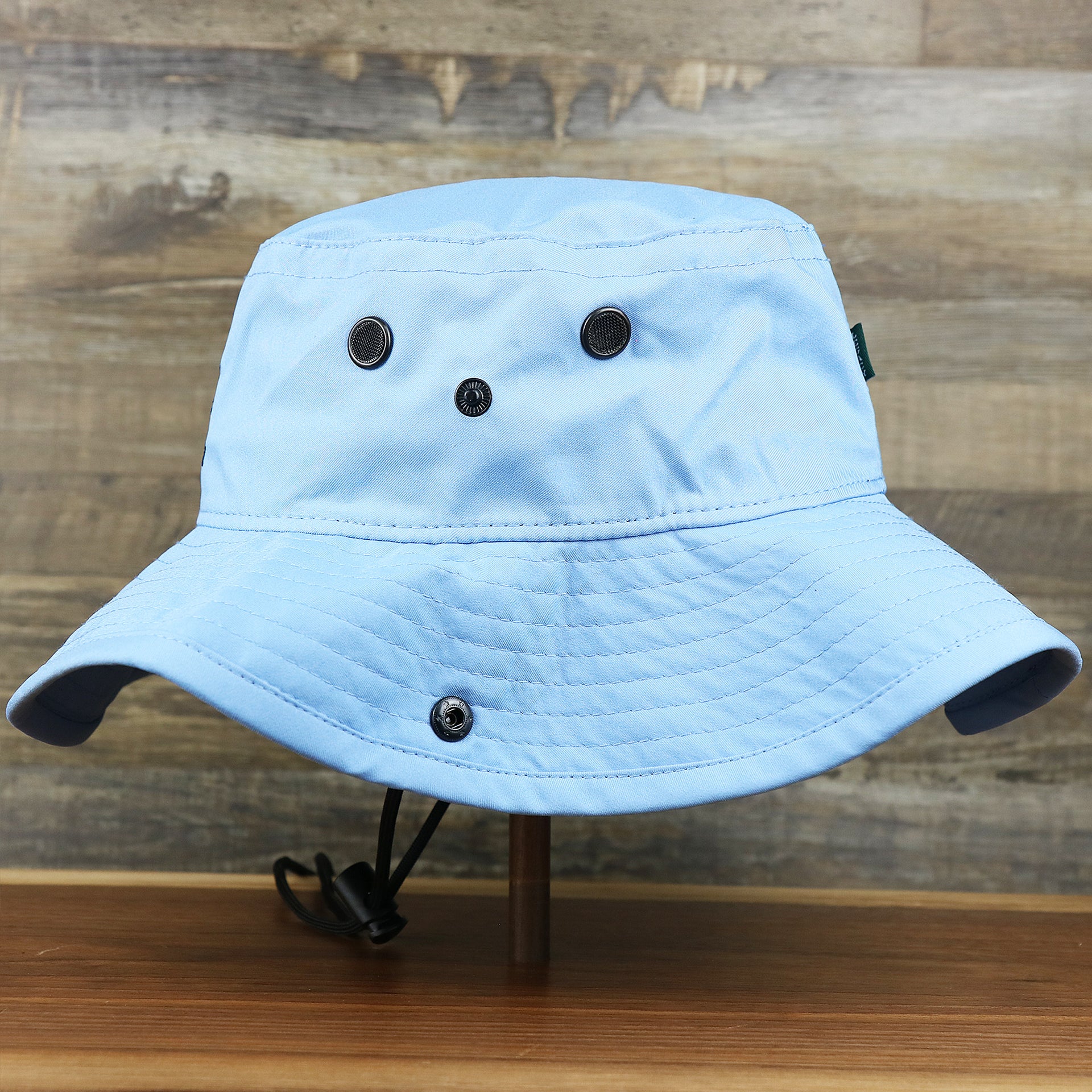The wearer's left on  the Ocean City New Jersey 1897 Bucket Hat | Light Blue Bucket Hat