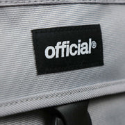 The official tag on the Essential Nylon Shoulder Bag Streetwear with Mesh Pocket | Official Gray