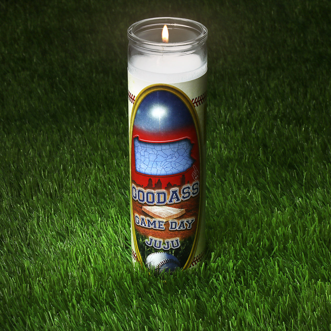 The Philadelphia Baseball Game Day Juju Unscented Prayer Candle lit up