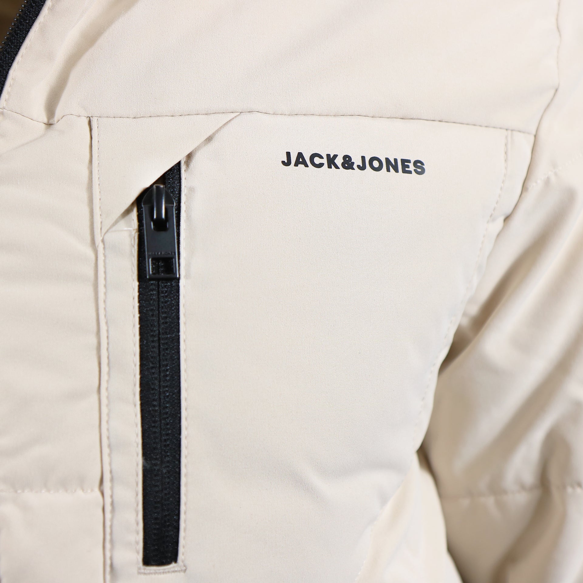 The Chest pocket on the Jack And Jones Moonbeam Puffer Jacket With Hidden Pocket | Cream Puffer Jacket