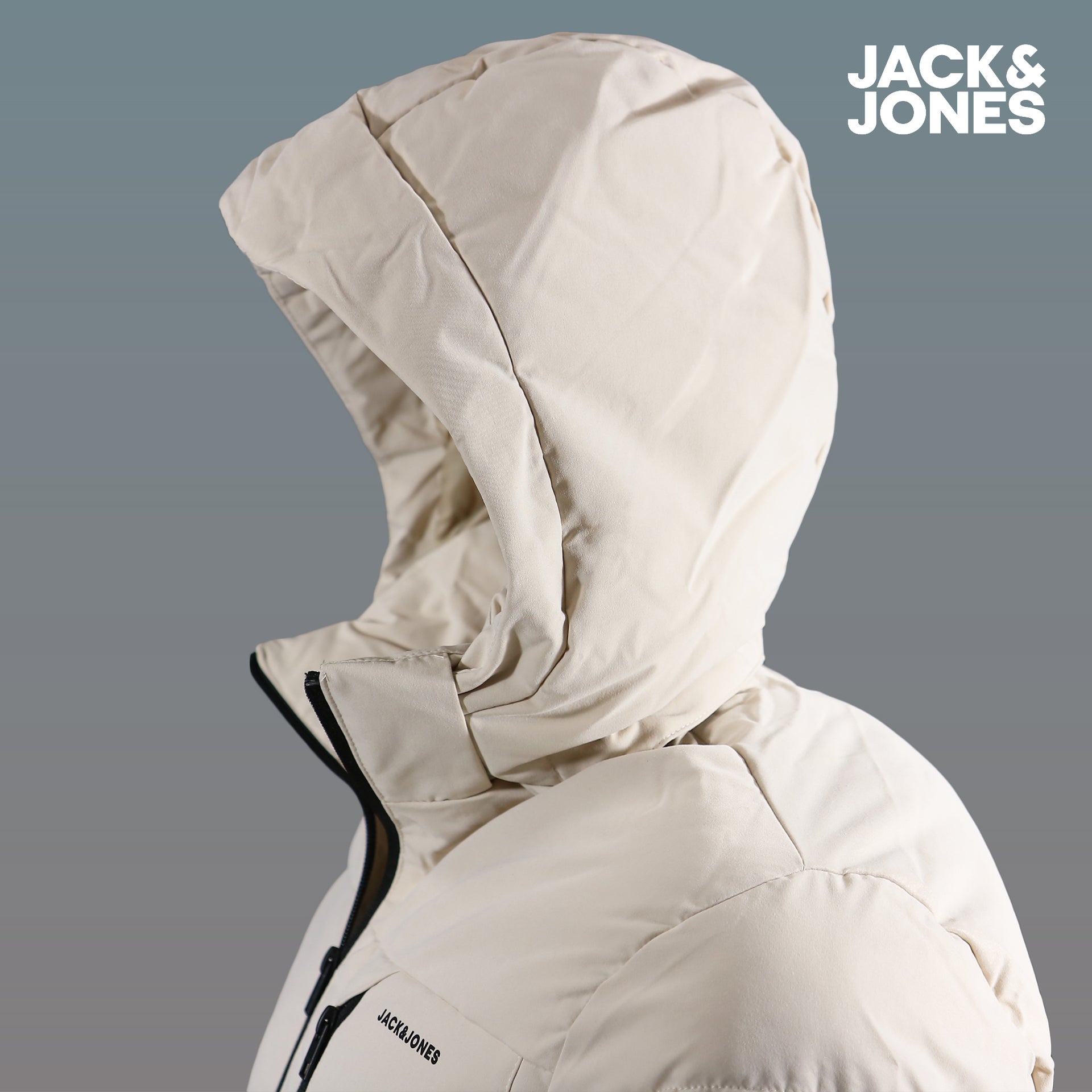 The hood on the Jack And Jones Moonbeam Puffer Jacket With Hidden Pocket | Cream Puffer Jacket