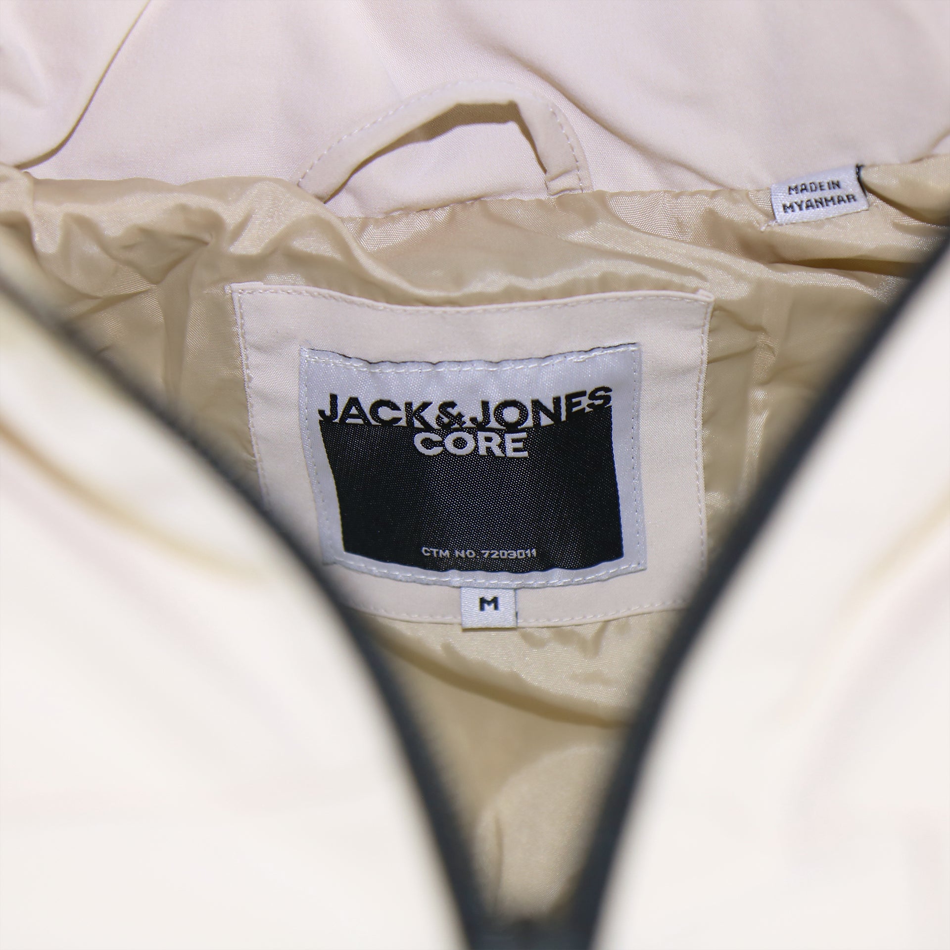 The Jack and Jones Tag on the Jack And Jones Moonbeam Puffer Jacket With Hidden Pocket | Cream Puffer Jacket