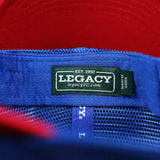 The Legacy Tag on the Ocean City Stars And Stripes USA Flag Royal Blue Mesh Trucker Hat | White And Royal Blue Trucker Hat