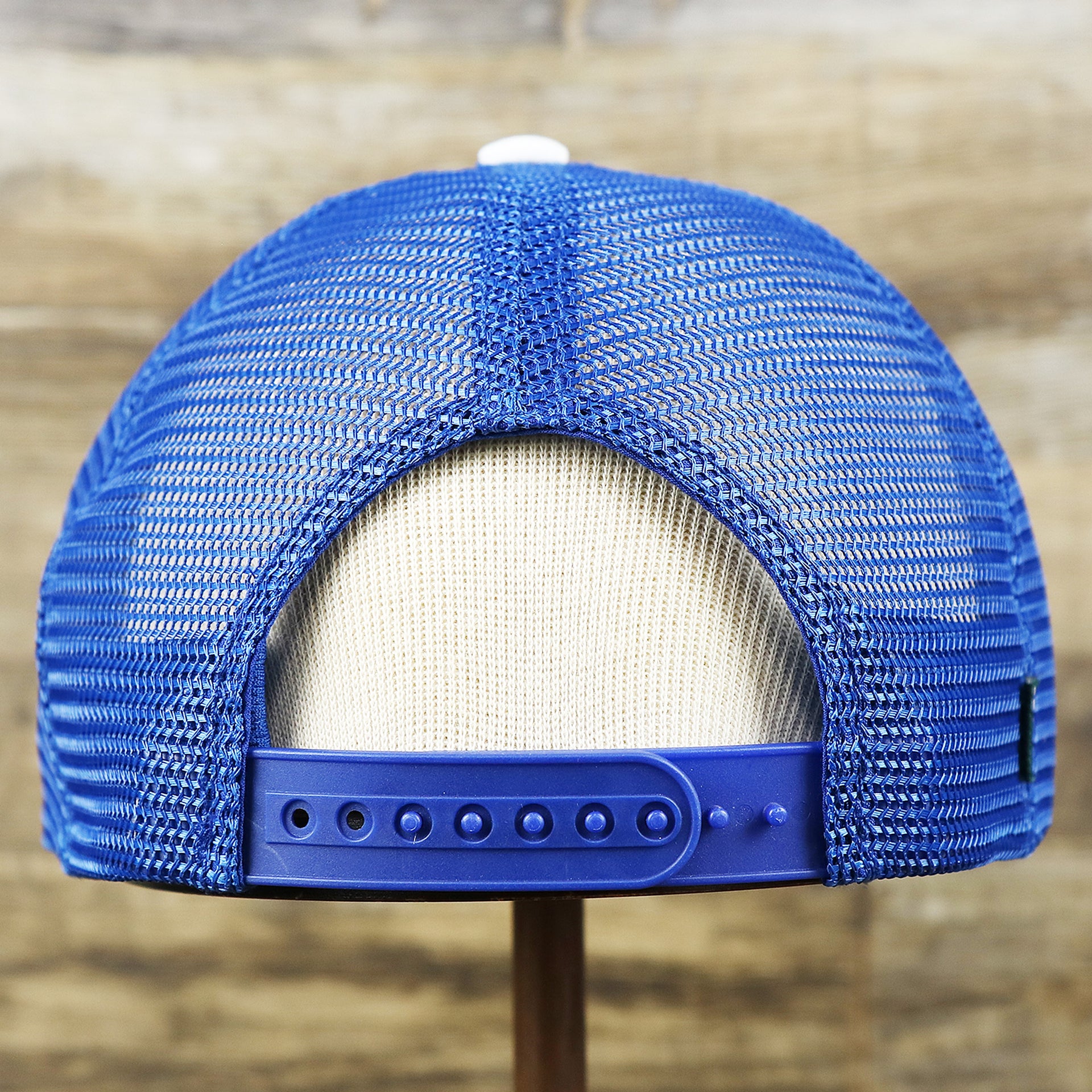 The backside of the Ocean City Stars And Stripes USA Flag Royal Blue Mesh Trucker Hat | White And Royal Blue Trucker Hat