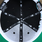 The inside of the Cooperstown Florida Marlins MLB Side Font Green Bottom 9Fifty Snapback Cap | Black Snap Cap