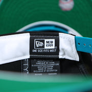 The New Era Tag on the Cooperstown Florida Marlins MLB Side Font Green Bottom 9Fifty Snapback Cap | Black Snap Cap