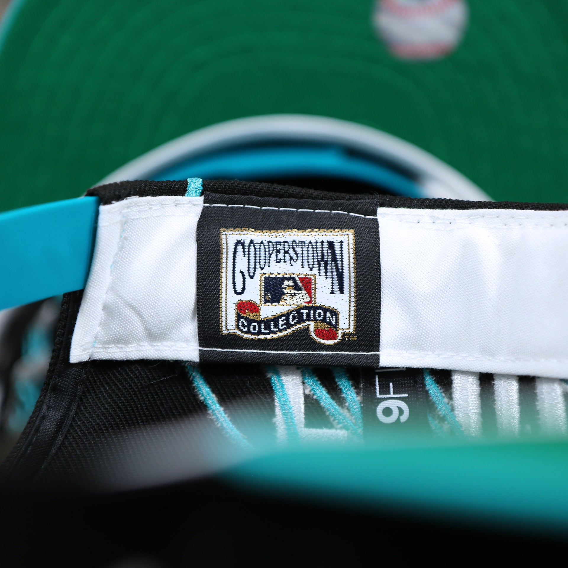 The Cooperstown Collection Tag on the Cooperstown Florida Marlins MLB Side Font Green Bottom 9Fifty Snapback Cap | Black Snap Cap