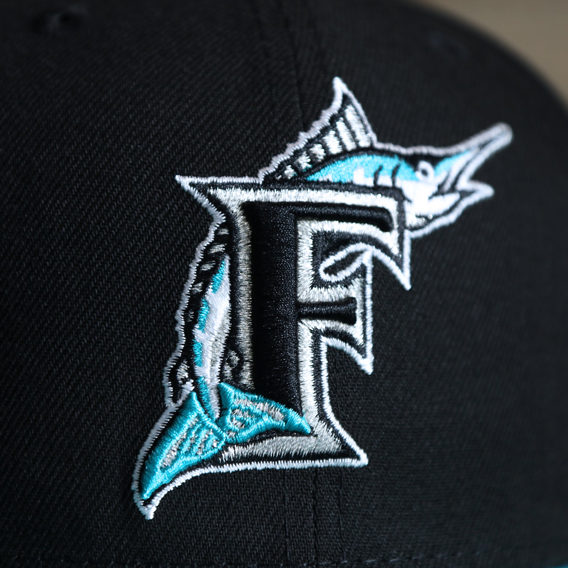 The Miami Marlins on the Cooperstown Florida Marlins MLB Side Font Green Bottom 9Fifty Snapback Cap | Black Snap Cap