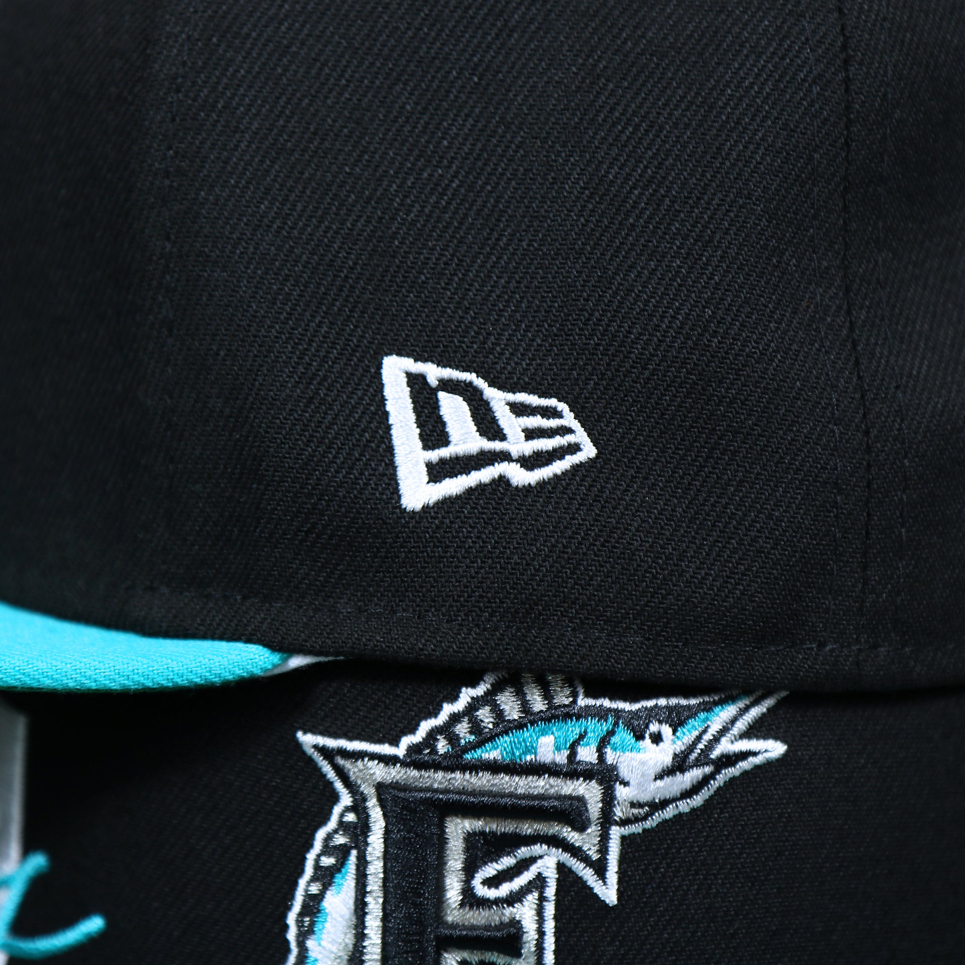 The New Era Logo on the Cooperstown Florida Marlins MLB Side Font Green Bottom 9Fifty Snapback Cap | Black Snap Cap