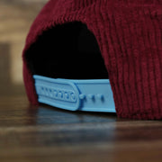 A close up of the adjustable strap on the Corduroy Philadelphia Phillies Cooperstown Snapback | 47 Brand Dark Maroon