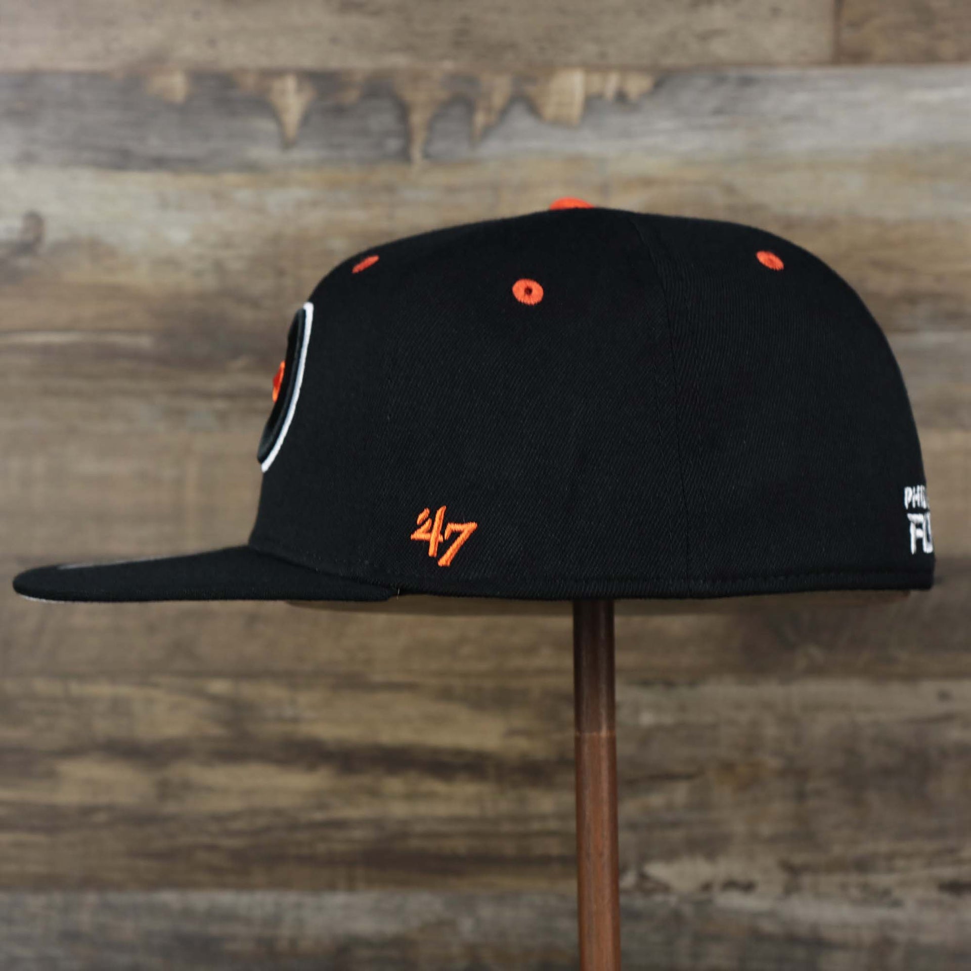 The wearer's left on the Philadelphia Flyers Side Patch Dugout Side Defender Fitted Cap | Black Stretch Fitted Cap