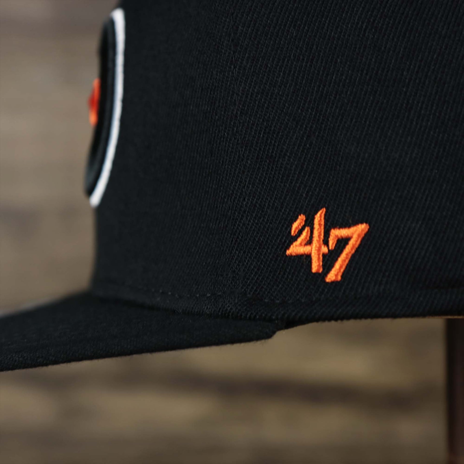 The 47 Brand Logo on the Philadelphia Flyers Side Patch Dugout Side Defender Fitted Cap | Black Stretch Fitted Cap
