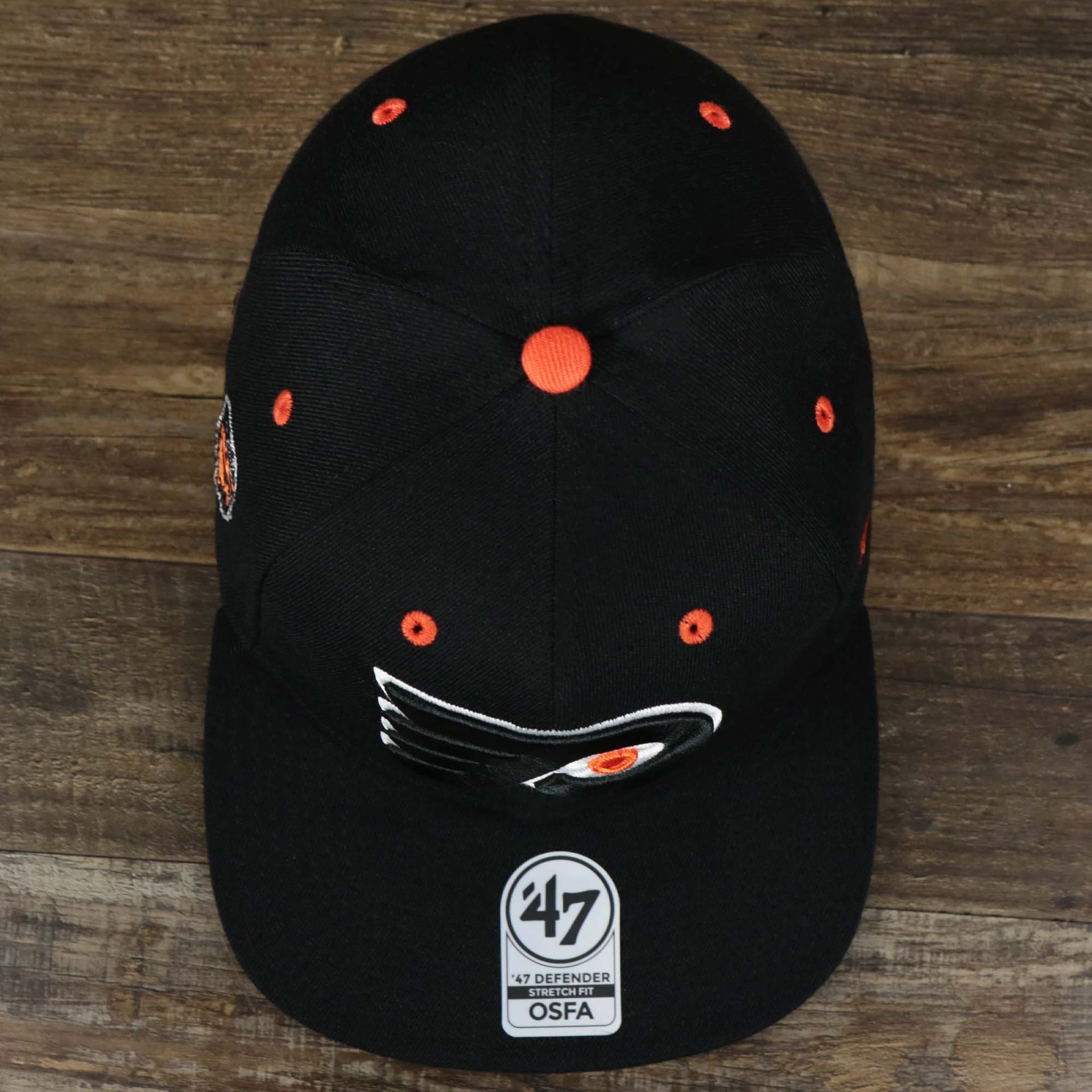 An Overhead shot on the Philadelphia Flyers Side Patch Dugout Side Defender Fitted Cap | Black Stretch Fitted Cap