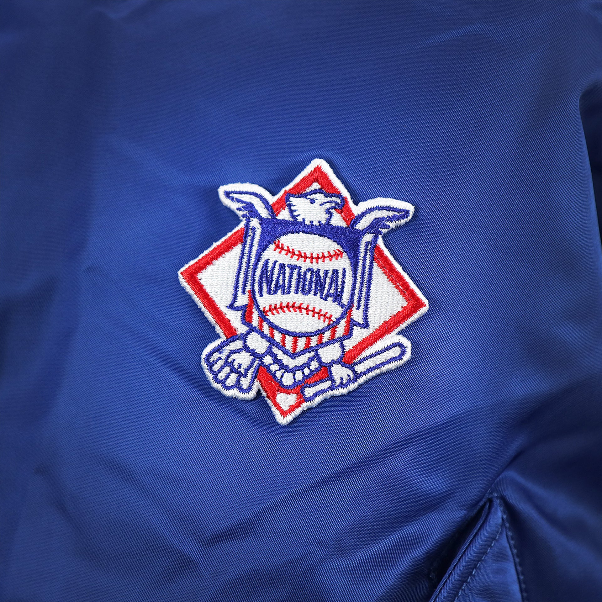 The National Baseball League Side Patch on the New York Mets MLB Patch Alpha Industries Reversible Bomber Jacket With Camo Liner | Royal Blue Bomber Jacket