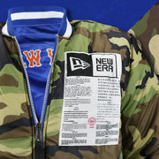 The Sports Unite Us Graphic on the New York Mets MLB Patch Alpha Industries Reversible Bomber Jacket With Camo Liner | Royal Blue Bomber Jacket