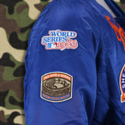 The World Series Mets Side Patches on the New York Mets MLB Patch Alpha Industries Reversible Bomber Jacket With Camo Liner | Royal Blue Bomber Jacket