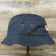 The wearer's right on the White OCNJ Double Wordmark Red Outline Bucket Hat | Navy Bucket Hat