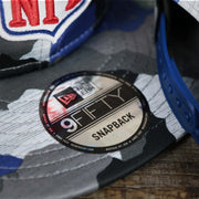 The 9Fifty Sticker on the NFL Logo OnField Summer Training 2022 Camo 9Fifty Snapback | Royal Blue Camo 9Fifty