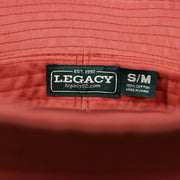 The Legacy Tag on the White OCNJ Double Wordmark Navy Blue Outline Bucket Hat | Nantucket Red Bucket Hat