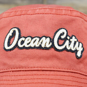 The Ocean City Wordmark on the White OCNJ Double Wordmark Navy Blue Outline Bucket Hat | Nantucket Red Bucket Hat