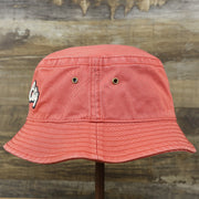 The wearer's left on the White OCNJ Double Wordmark Navy Blue Outline Bucket Hat | Nantucket Red Bucket Hat