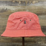 The wearer's right on the White OCNJ Double Wordmark Navy Blue Outline Bucket Hat | Nantucket Red Bucket Hat