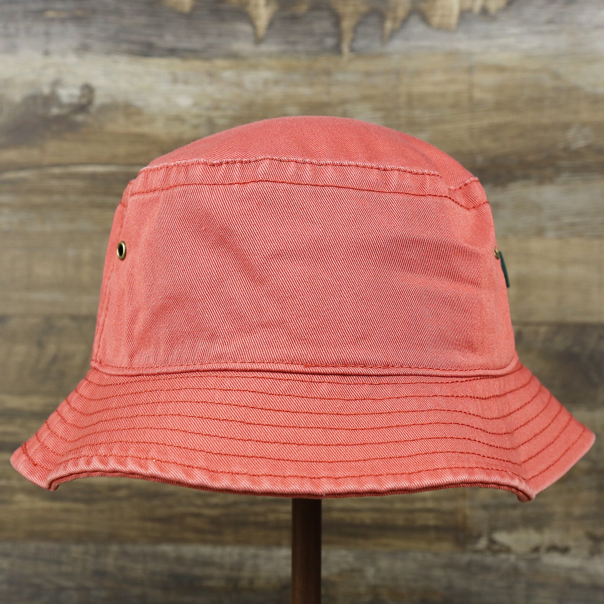 The backside of the White OCNJ Double Wordmark Navy Blue Outline Bucket Hat | Nantucket Red Bucket Hat