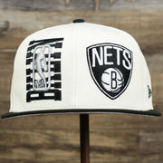 The front of the Youth Brooklyn Nets NBA 2022 Draft Gray Bottom 9Fifty Snapback | New Era Cream/Black