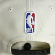 The NBA Jerry West Logo on the back of the Youth Brooklyn Nets NBA 2022 Draft Gray Bottom 9Fifty Snapback | New Era Cream/Black