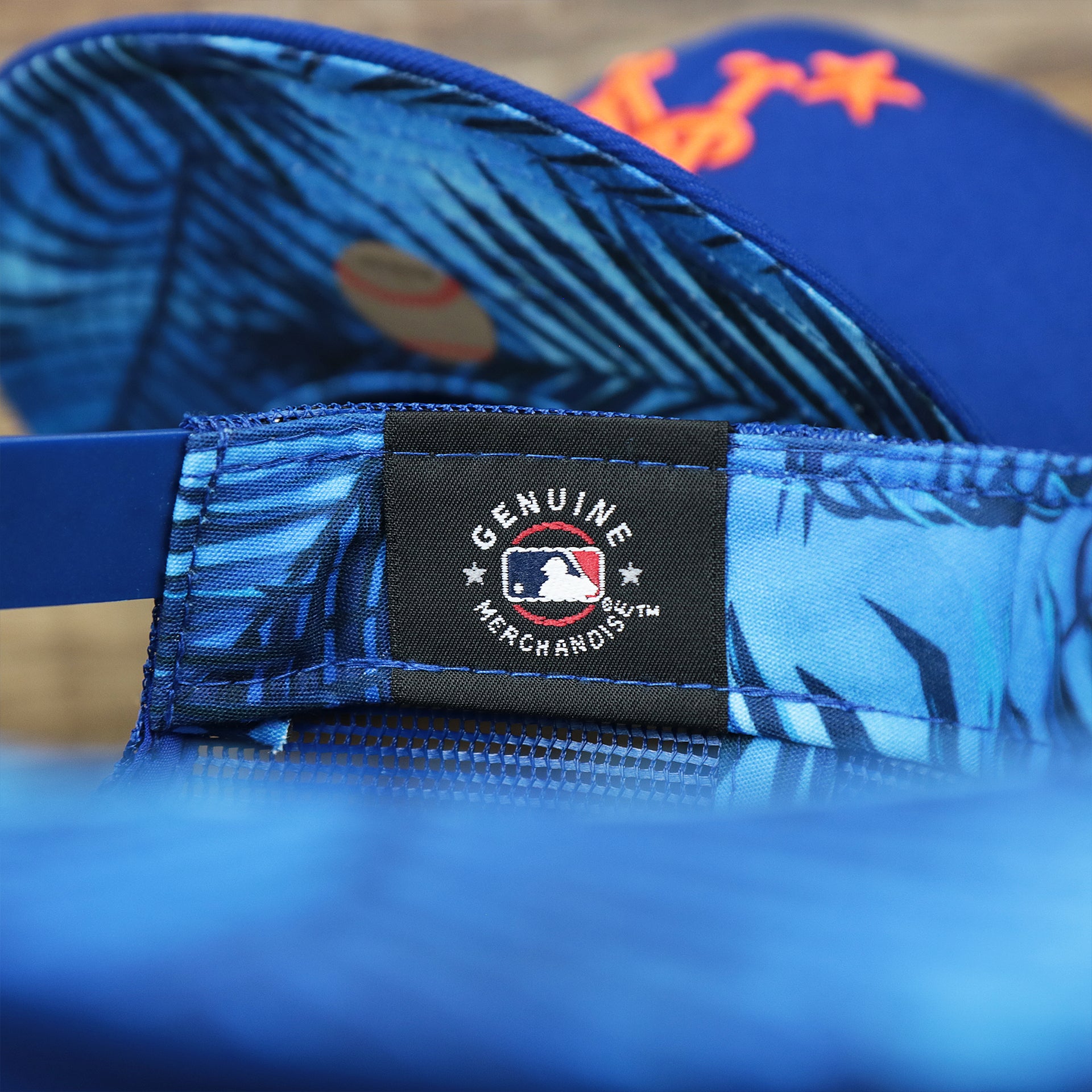 The MLB Merchandise Tag on the New York Mets Metallic All Star Game MLB 2022 Side Patch 9Fifty Mesh Snapback | ASG 2022 Royal Blue Trucker Hat