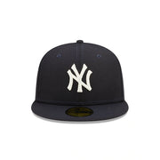 The front of the New York Yankees Pop Sweat Pastel World Series Side Patch Fitted Cap With Pink Undervisor | Navy Blue 59Fifty Cap