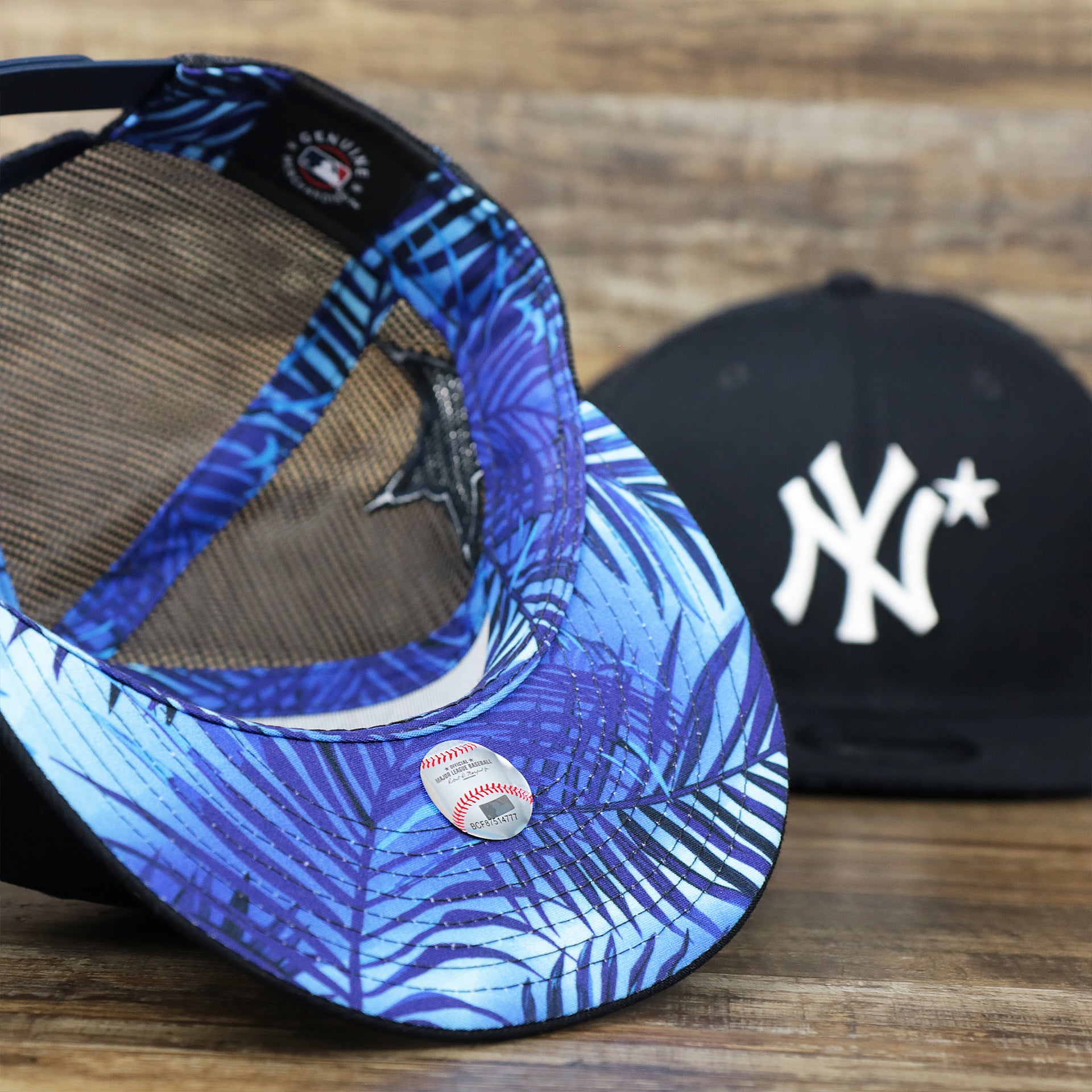 The undervisor on the New York Yankees Metallic All Star Game MLB 2022 Side Patch 9Fifty Mesh Snapback | ASG 2022 Navy Blue Trucker Hat