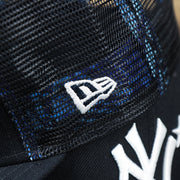 The New Era Logo on the New York Yankees Metallic All Star Game MLB 2022 Side Patch 9Fifty Mesh Snapback | ASG 2022 Navy Blue Trucker Hat