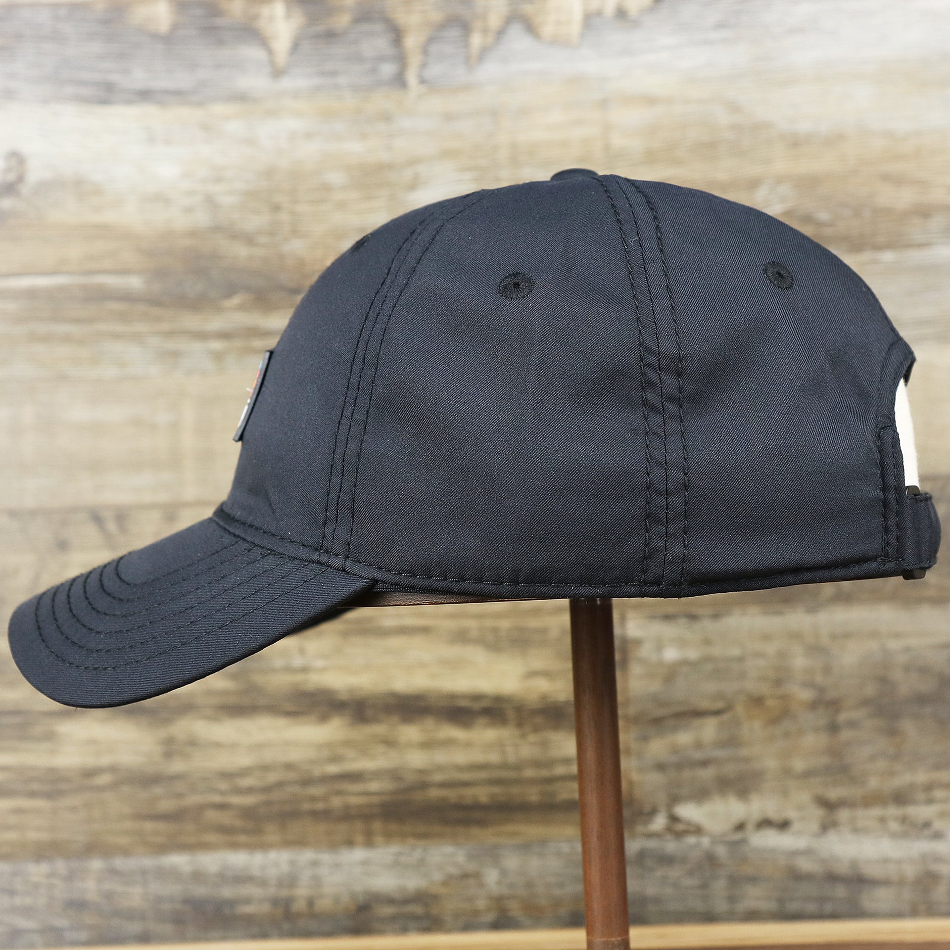 The wearer's left on the New Jersey High Point PVC Ocean City Rubber Patch Cool Fit Adjustable Dad Hat | Black Dad Hat