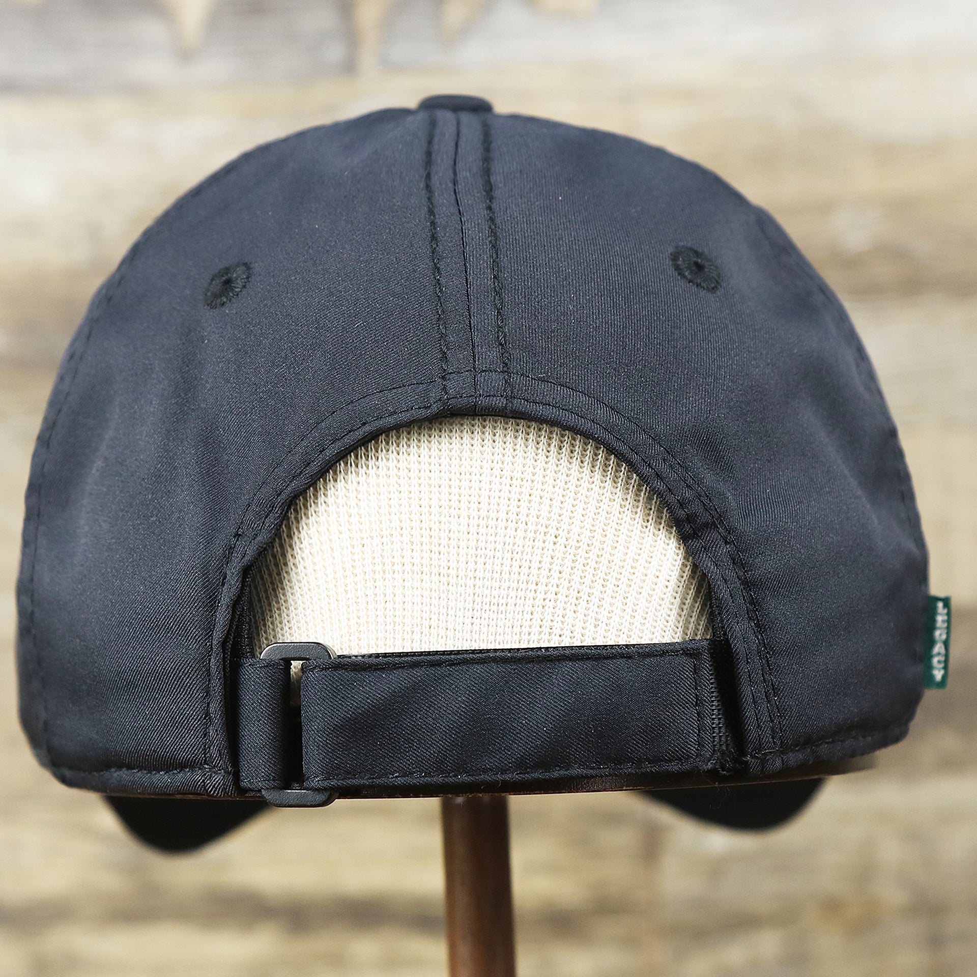 The backside of the New Jersey High Point PVC Ocean City Rubber Patch Cool Fit Adjustable Dad Hat | Black Dad Hat