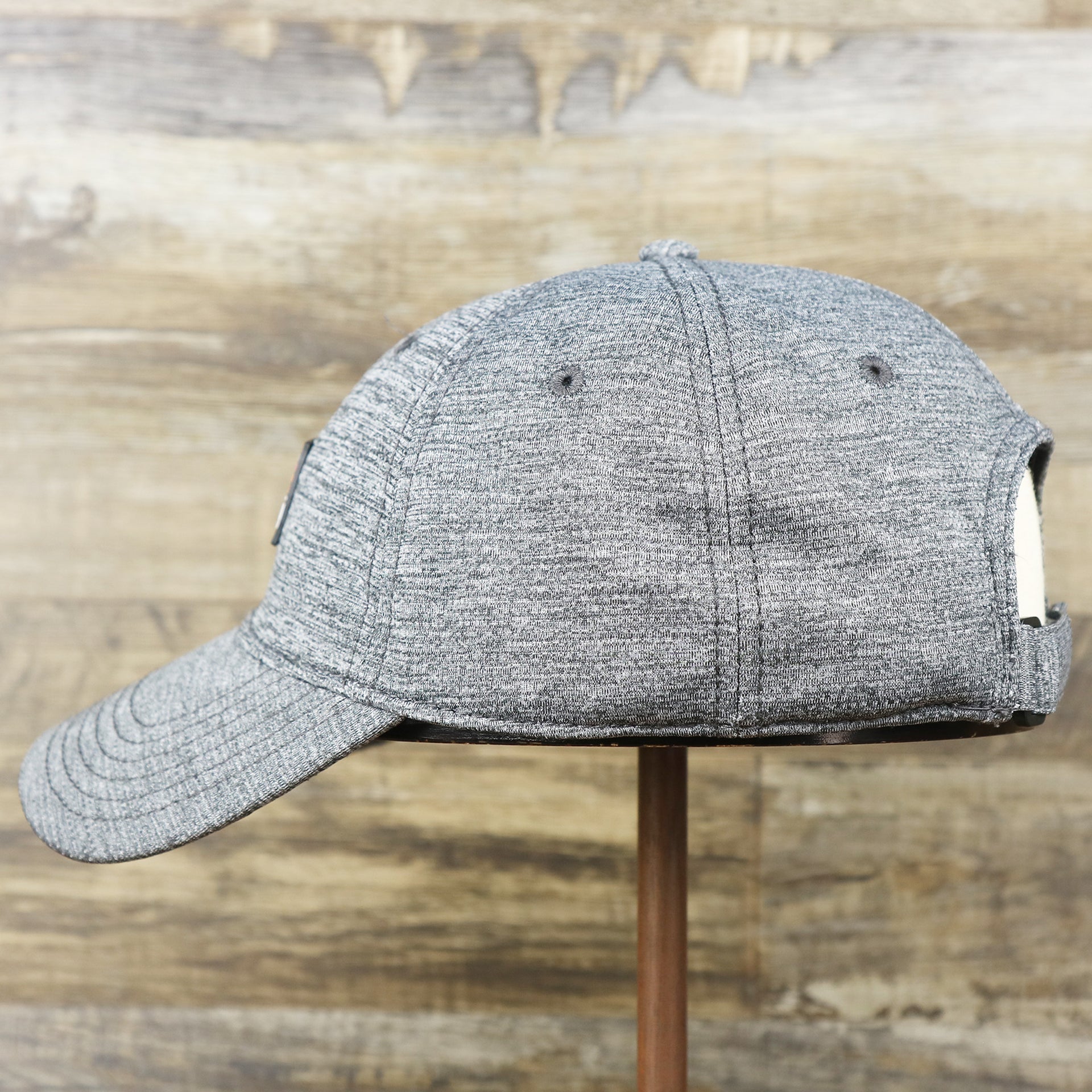 The wearer's left on the New Jersey High Point PVC Ocean City Rubber Patch Cool Fit Adjustable Dad Hat | Performance Gray Dad Hat