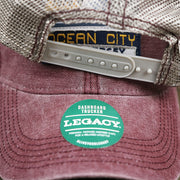 The Legacy Sticker on the OCNJ 1879 Ocean City New Jersey Wave Trucker Hat | Burgundy And Khaki Mesh Trucker Hat