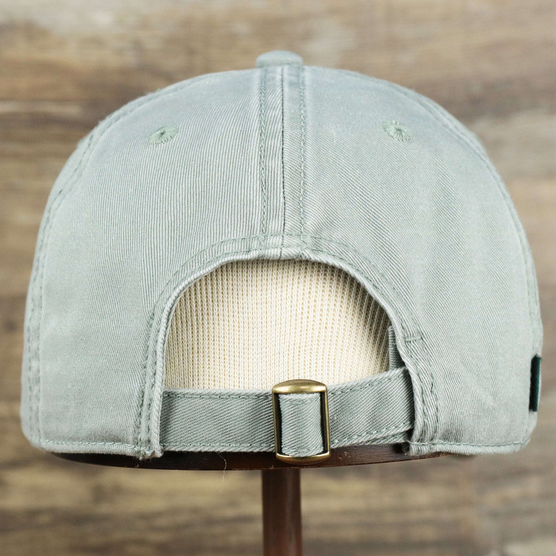 The backside of the Pink OCNJ Wordmark White Outline Dad Hat | Sawgrass Dad Hat