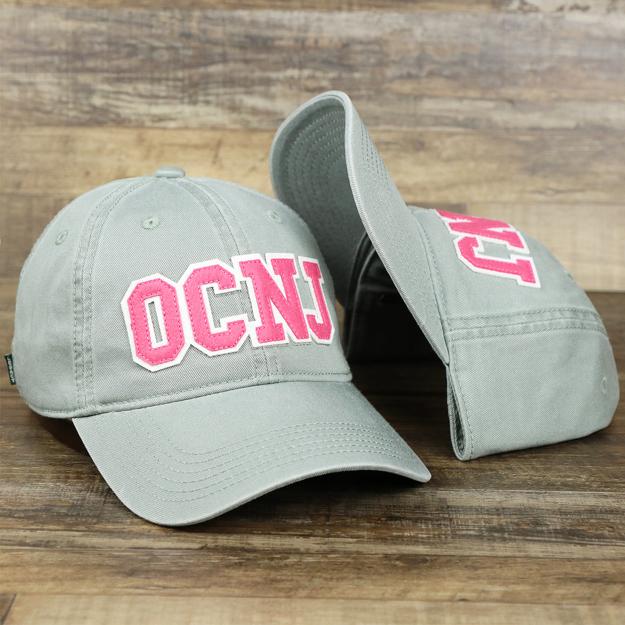 The Pink OCNJ Wordmark White Outline Dad Hat | Sawgrass Dad Hat