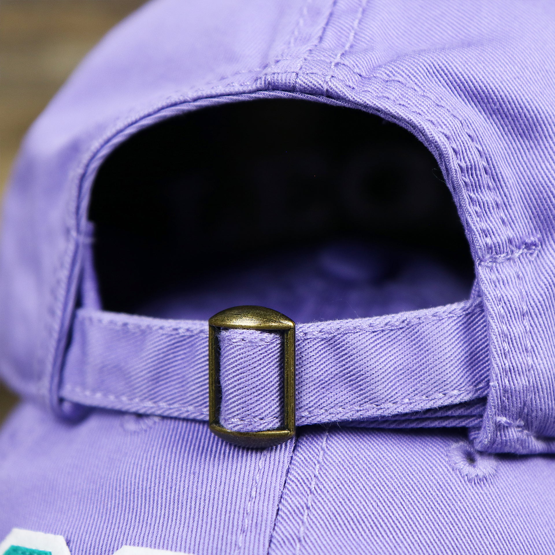 The Lavender Adjustable Strap on the Teal OCNJ Double Wordmark White Outline Bucket Hat | Lavender Bucket Hat