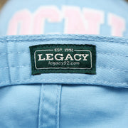 The Legacy Tag on the Pink OCNJ Wordmark White Outline Dad Hat | Light Blue Dad Hat