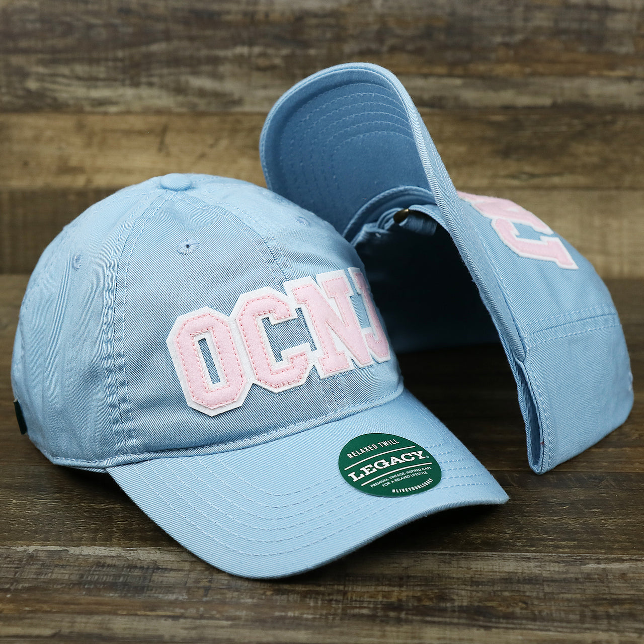 The Youth Pink OCNJ Wordmark White Outline Dad Hat | Youth Light Blue Dad Hat