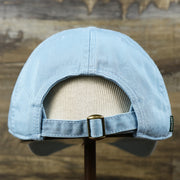 The backside of the Youth Pink OCNJ Wordmark White Outline Dad Hat | Youth Light Blue Dad Hat