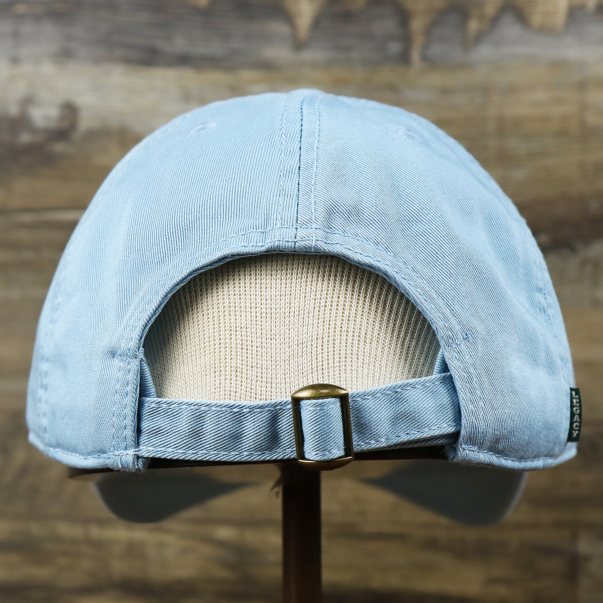 The backside of the Pink OCNJ Wordmark White Outline Dad Hat | Light Blue Dad Hat