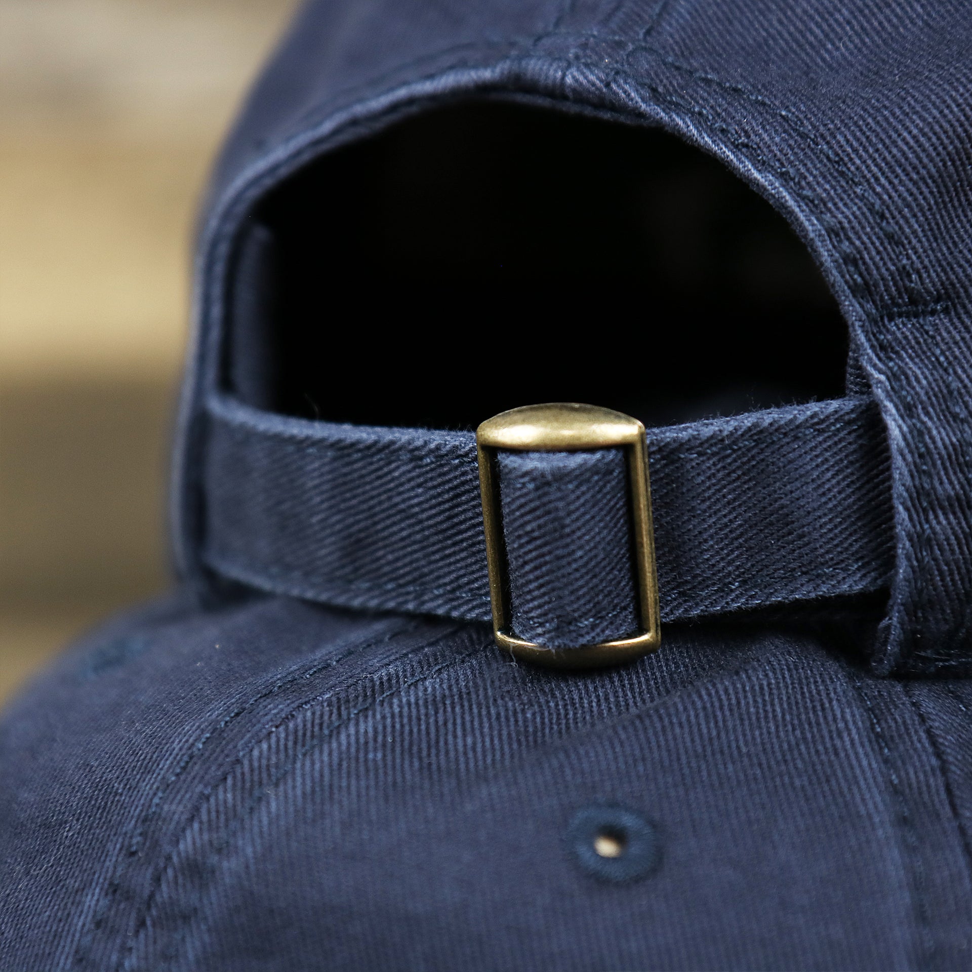 The Navy Adjustable Strap on the Youth Light Blue OCNJ Wordmark White Outline Dad Hat | Youth Navy Blue Dad Hat