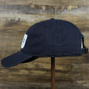 The wearer's left on the Light Blue OCNJ Wordmark White Outline Dad Hat | Navy Blue Dad Hat