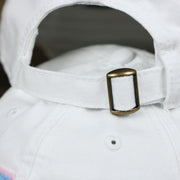 The White adjustable Strap on the Light Blue OCNJ Wordmark Pink Outline Dad Hat | White Dad Hat